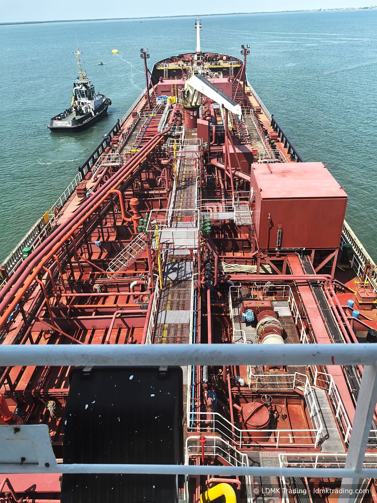 Product tanker bow with escort tug